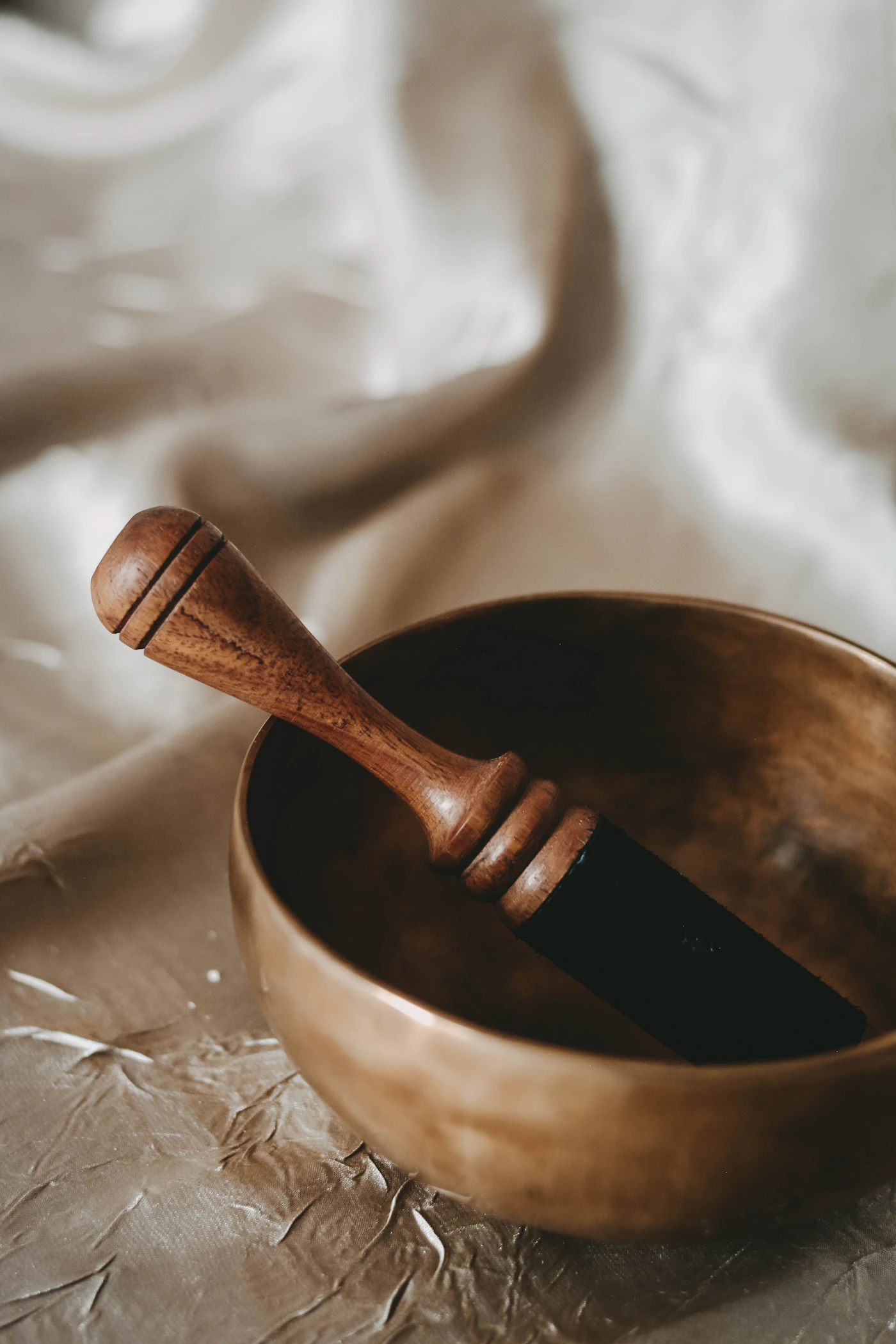 A singing bowl with a wooden mallet